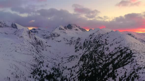 Aerial video of mountain peaks during the winter alt