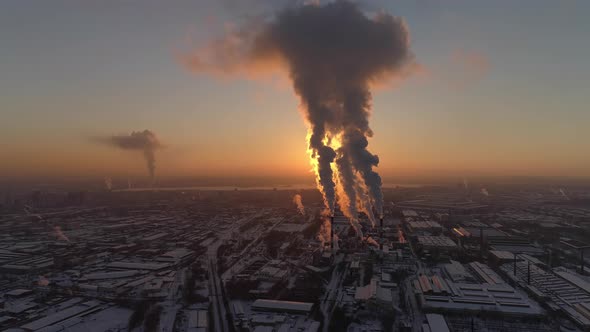 Aerial view of Smoke comes from the pipes of the factory at sunset 04 alt