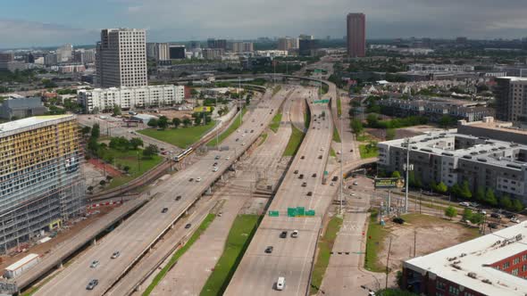 Forward Flying Drone Over Multilane Highway Heading to Intersection alt