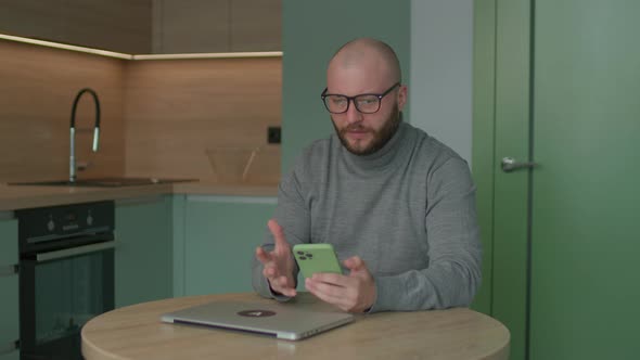 Irritated 30s Man Reading Bad News on Mobile Phone and Getting Angry and Nervous alt