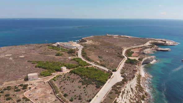 Aerial drone video from eastern Malta, Marsaxlokk area, Il-Hofra l-Kbira bay. alt