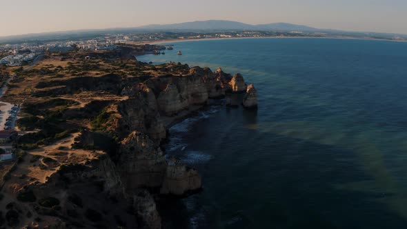Aerial View of the sea cliff at Ponta Da Piedade in Algarve, Portugal 4K