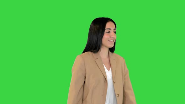 Indian Girl Walking and Smiling on a Green Screen Chroma Key