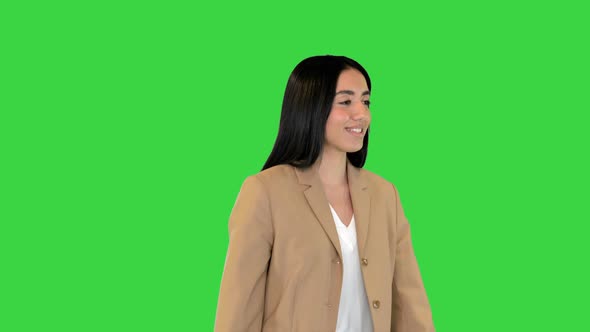 Indian Girl Walking and Smiling on a Green Screen Chroma Key alt