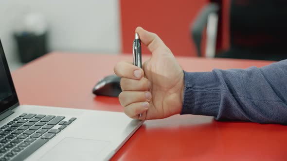 Stressed Businessman Working with Laptop Computer in Office. Anxious Man Under Deadline at Work with alt