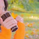 Beautiful Woman Enjoying Autumn Park and Drinking Hot Coffee - VideoHive Item for Sale