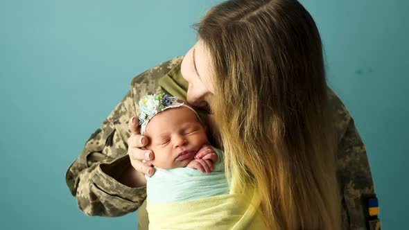 Ukrainian Military Woman with Baby Girl alt