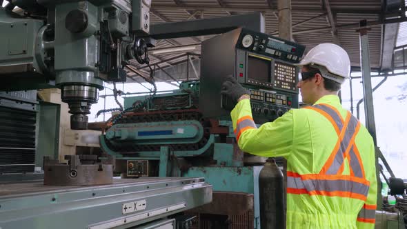 Smart Factory Worker Using Machine in Factory Workshop alt