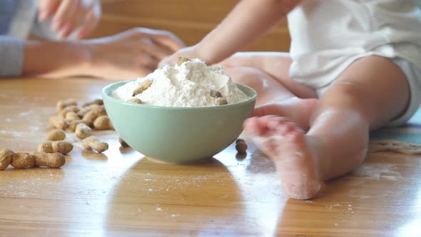 Happy Family Playing with Flour in the Kitchen. Happy Family Concept. alt