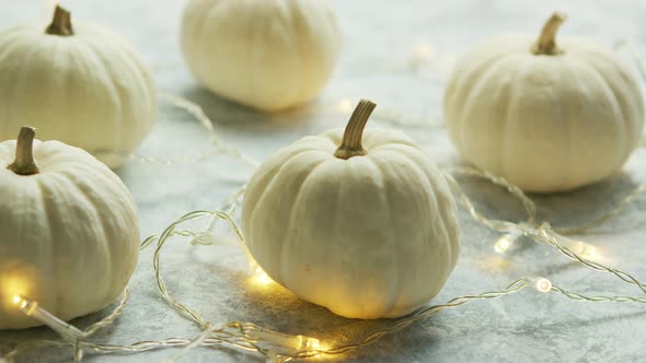 White Pumpkins with Garland on Table alt