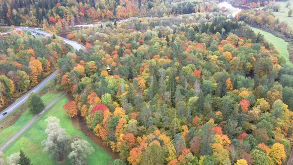 Aerial View of the Sigulda Bridge and Cable Car Over Gauja River During Golden Autumn Season Latvia alt