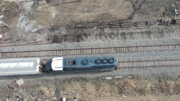 American train hauling box carts near Detroit, Michigan. Aerial view alt