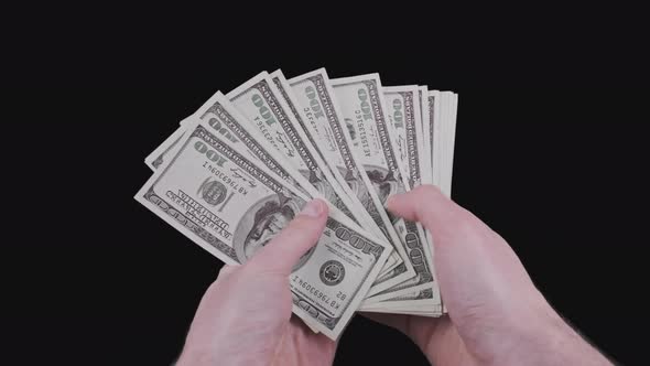 Male Hands Counting Lot of 100 American Dollar Banknotes Fan with Alpha Channel alt