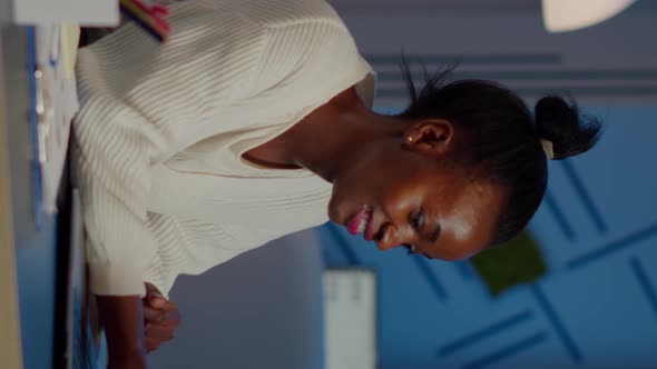 Excited Black Freelancer Receving Good News on Laptop Working Overtime alt