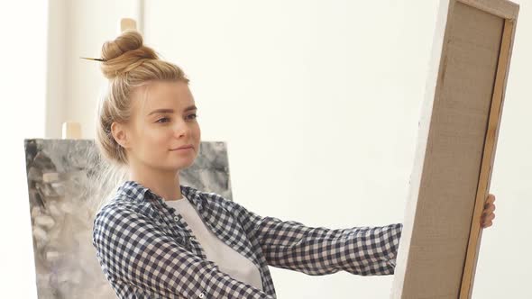 Young Talented Blond Girl Presents Her Artistic Work alt