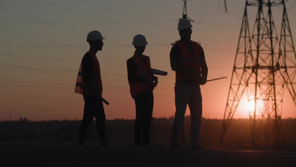Power Plant Construction Industry Experts Female and Male in Protective Helmets Discussing alt