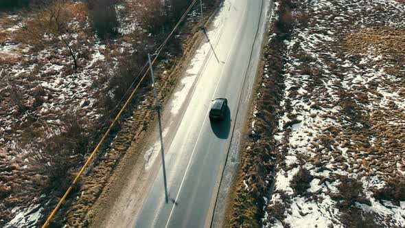 Car Riding on Winter Road with Snow in Countryside Nature in Winter alt