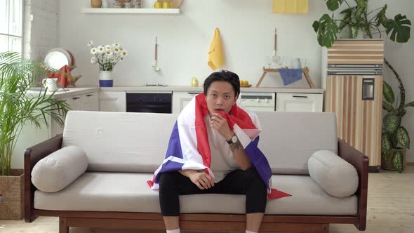 An Asian Man with the Flag of Thailand Supports the National Team alt