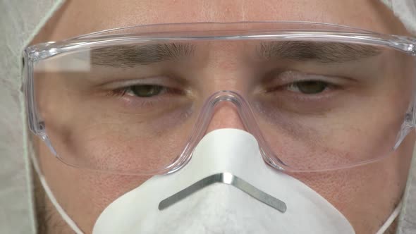Close Up Young Man Wearing Glasses and Mask to Protect Himself From Virus Infection alt