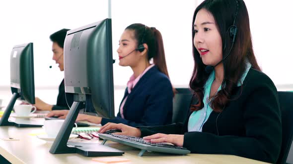 Business People Wearing Headset Working in Office alt
