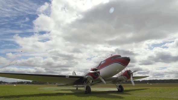 Small Private Airplane with Spinning Propeller Stand on Landing Strip of Airport alt