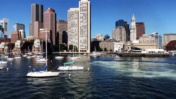 Boston skyline panning from board of a ship with view of Inner Harbor, small boats and the skyline o alt