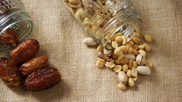 Various dried fruits on textile background 4k alt
