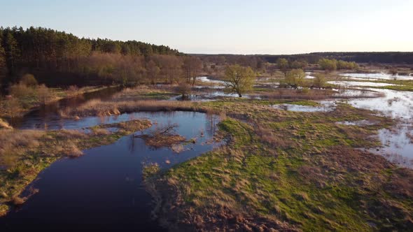 Aerial footage of flooded river in the evening