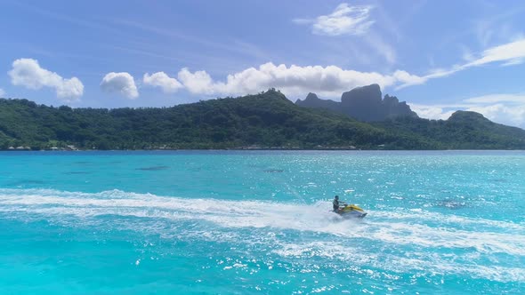 Aerial drone view of jetski personal watercraft in Bora Bora tropical island. alt