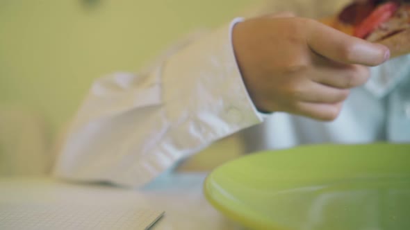 Boy in Shirt Has Lunch with Fresh Pizza at Table Closeup alt