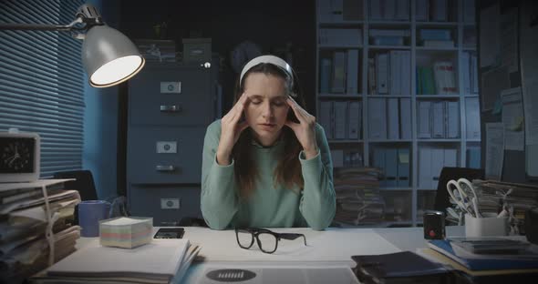 Exhausted office worker having a bad headache