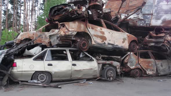 War in Ukraine a Dump of Shot and Burned Cars in Irpin Bucha District alt