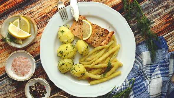 Fresh and Tasty Baked Salmon Served with Young Boiled Potatoes and Yellow Bean alt