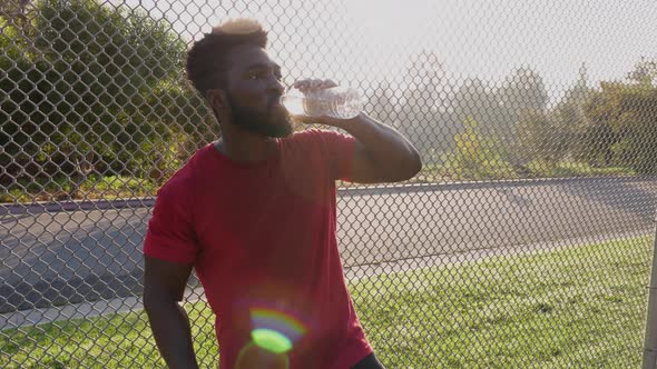 Man taking a rest break from his workout alt