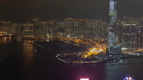 Hong Kong Urban Cityscape Aerial Skyline Panorama Timelapse at Night Pan Up alt