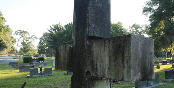 Cross Tombstone In Graveyard