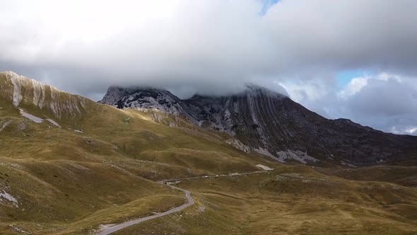 Drone View of Mountain Rock Covered with Grey Cloud
