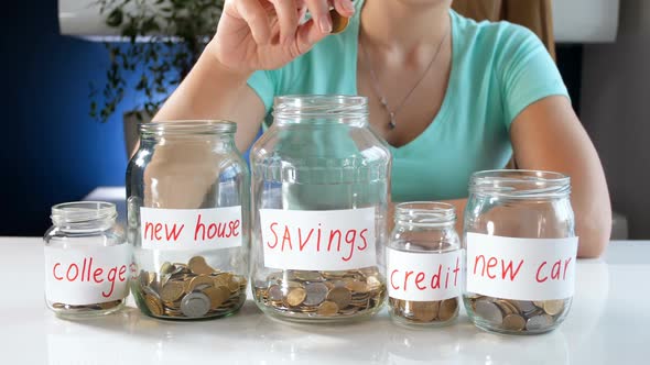 Closeup  Footage of Young Woman Choosing Where to Invest Her Money Savings alt