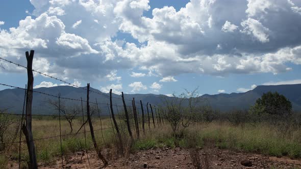 Cumulus Clouds Over Rural Scene Zoom Out Timelapse