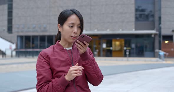 Woman look at mobile phone at outdoor