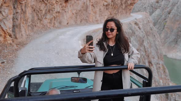 Traveler Tourist In Car Takes Selfie alt