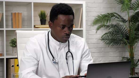 African American Man Online Doctor Talking to Patient Video Call Webcam Laptop alt