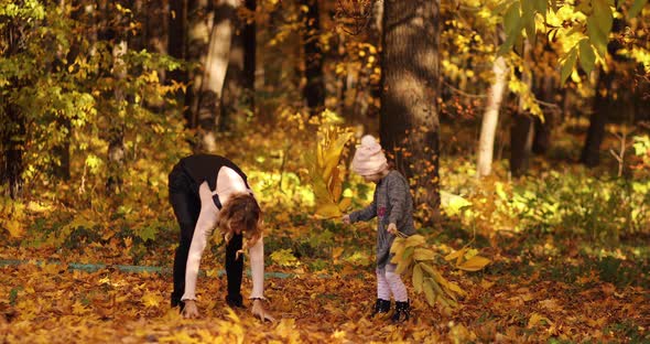 Young Light Haired Woman Playing with Her Lovely Child