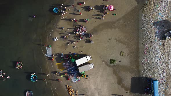 Aerial View Looking Directly Down at People Fishing at Mui Ne Beach in Vietnam. alt
