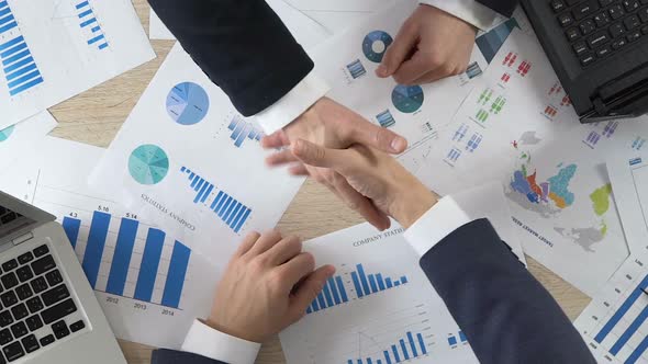 Deal of the Year, Two Successful Businessmen Shaking Hands, Slow-Motion Video alt