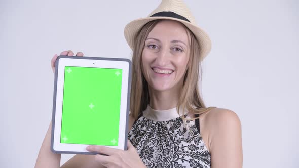 Face of Happy Blonde Tourist Woman Showing Digital Tablet alt