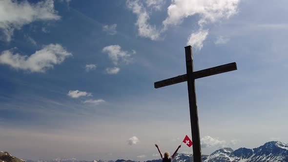 Woman on Top of Piz Scalottas Swiss Flag alt