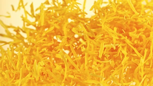 Super Slow Motion Shot of Flying Grated Cheddar Cheese at 1000 Fps alt