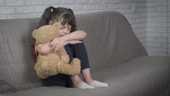 Depression Girl Hugging Toy alt