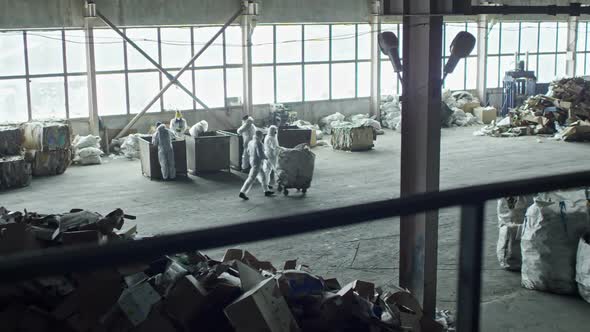 Busy Workers of Garbage Recycling Facility alt